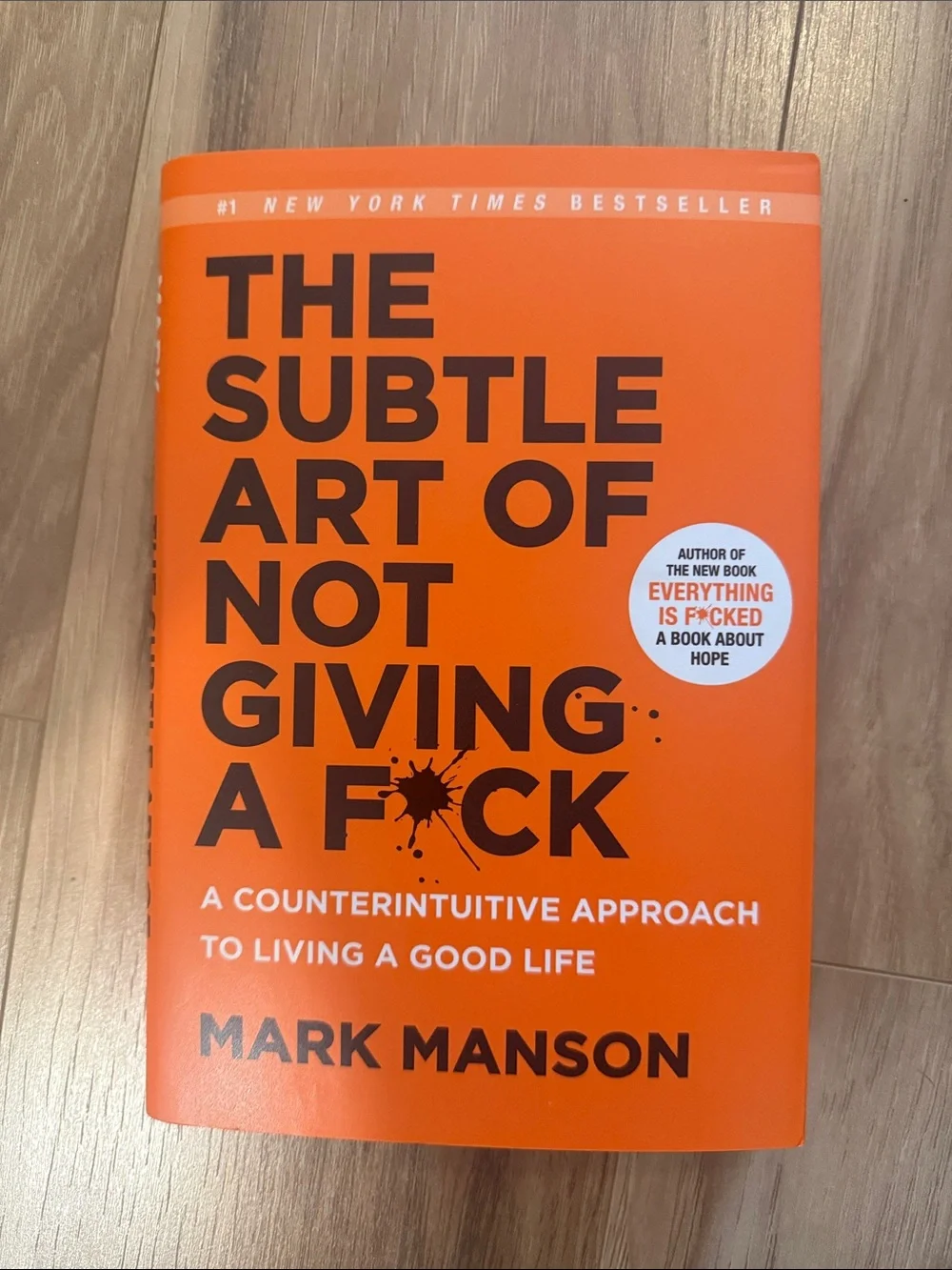 The Subtle Art of Not Giving a F*ck — Orange Hardcover Book